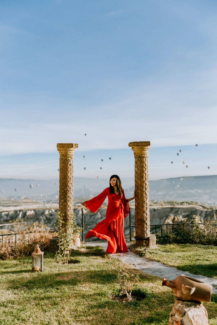 Bride in a flowing dress during a photoshoot in the Cappadocia valleys